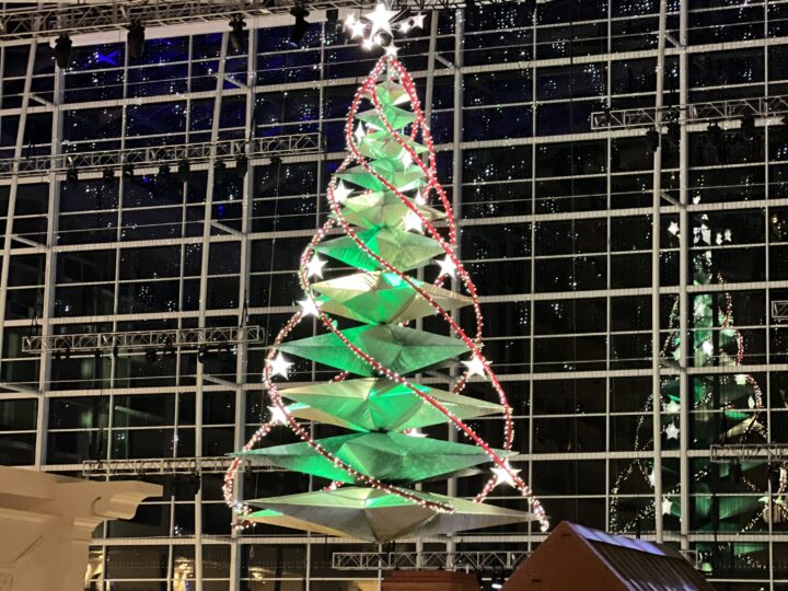 Hanging Christmas tree at Gaylord National Resort reflecting on back window portrait image