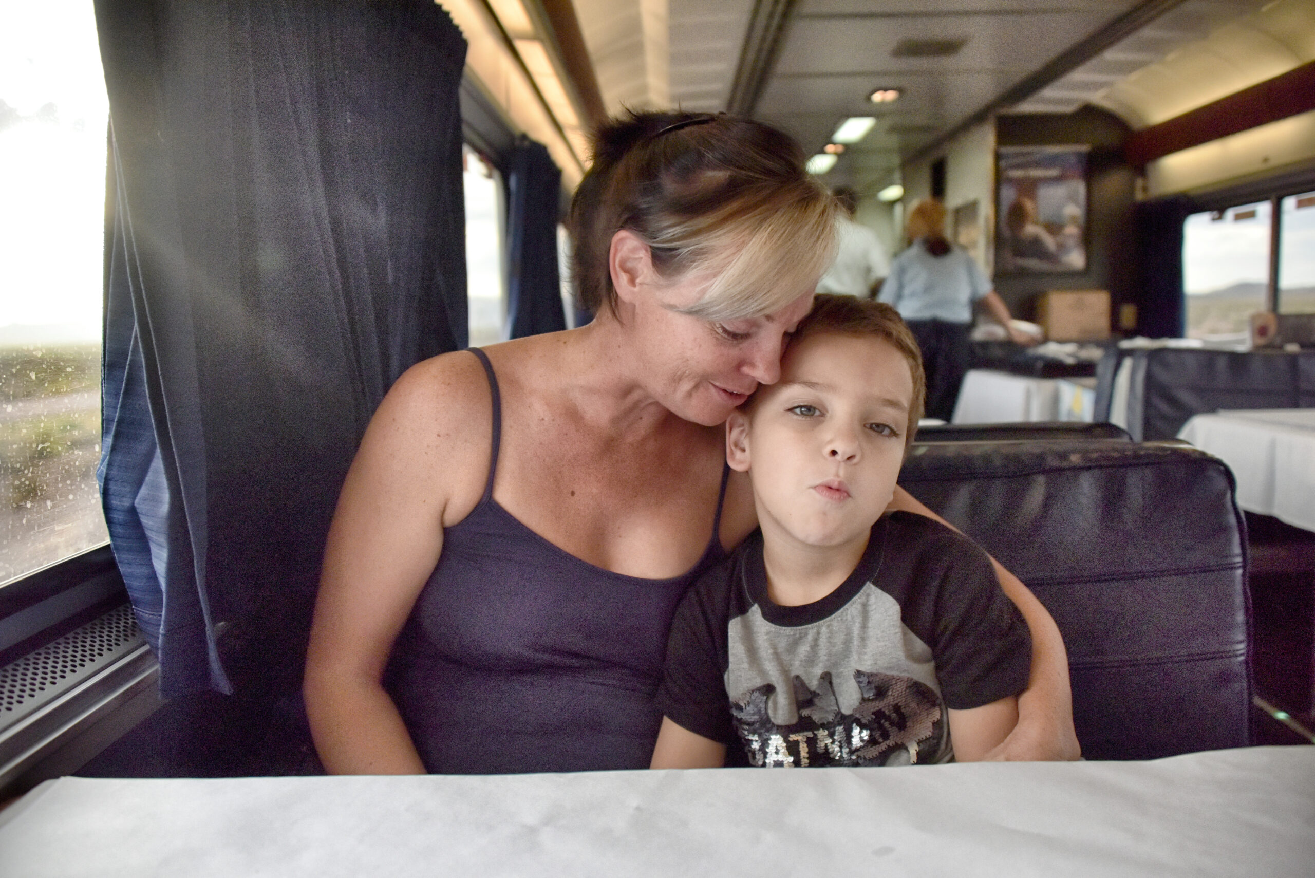 Mother and son in the coach car of an amtrak train in NJ Sunset Limited_5908