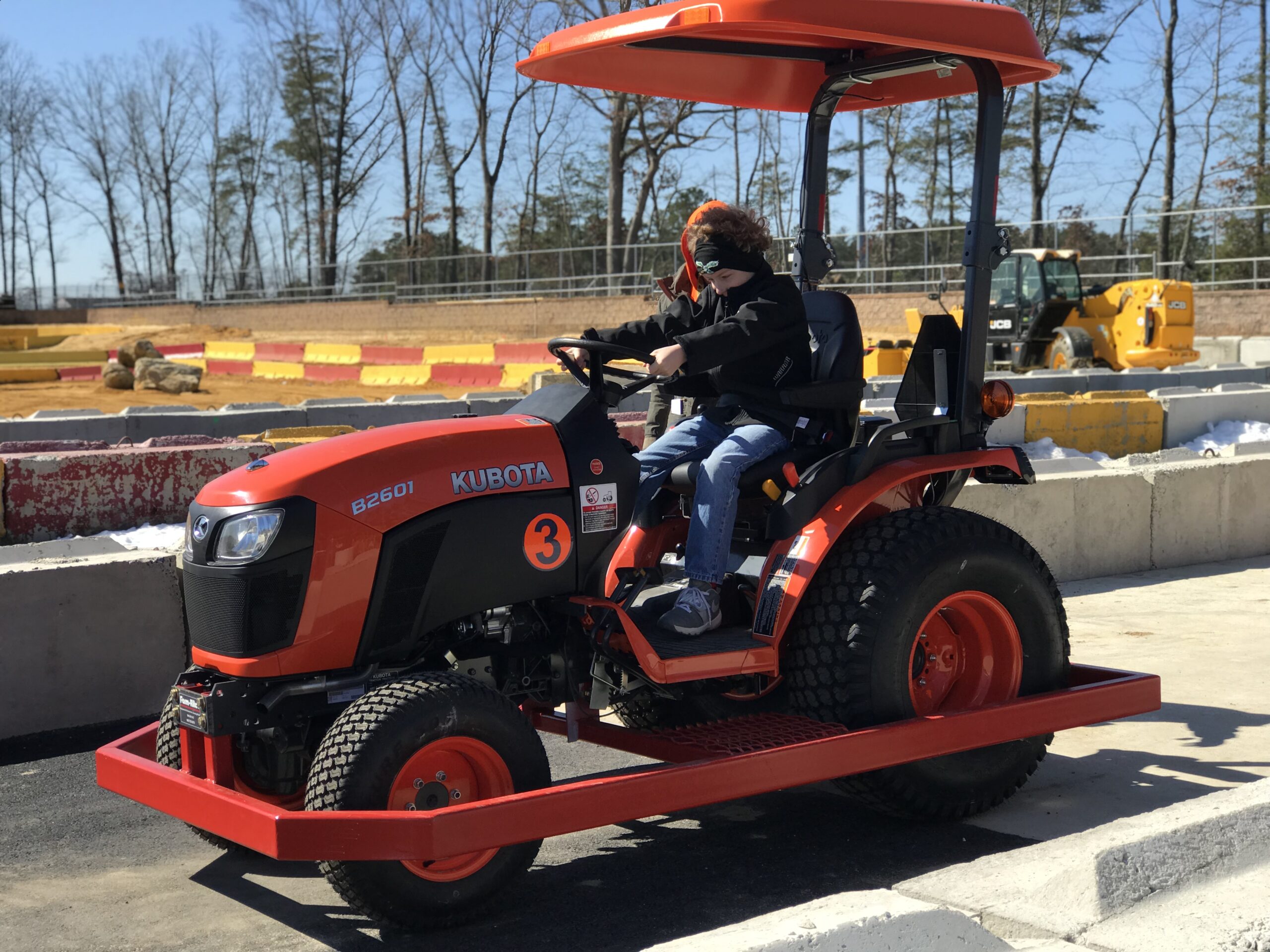 Boy drives Farm Tractors at Diggerland