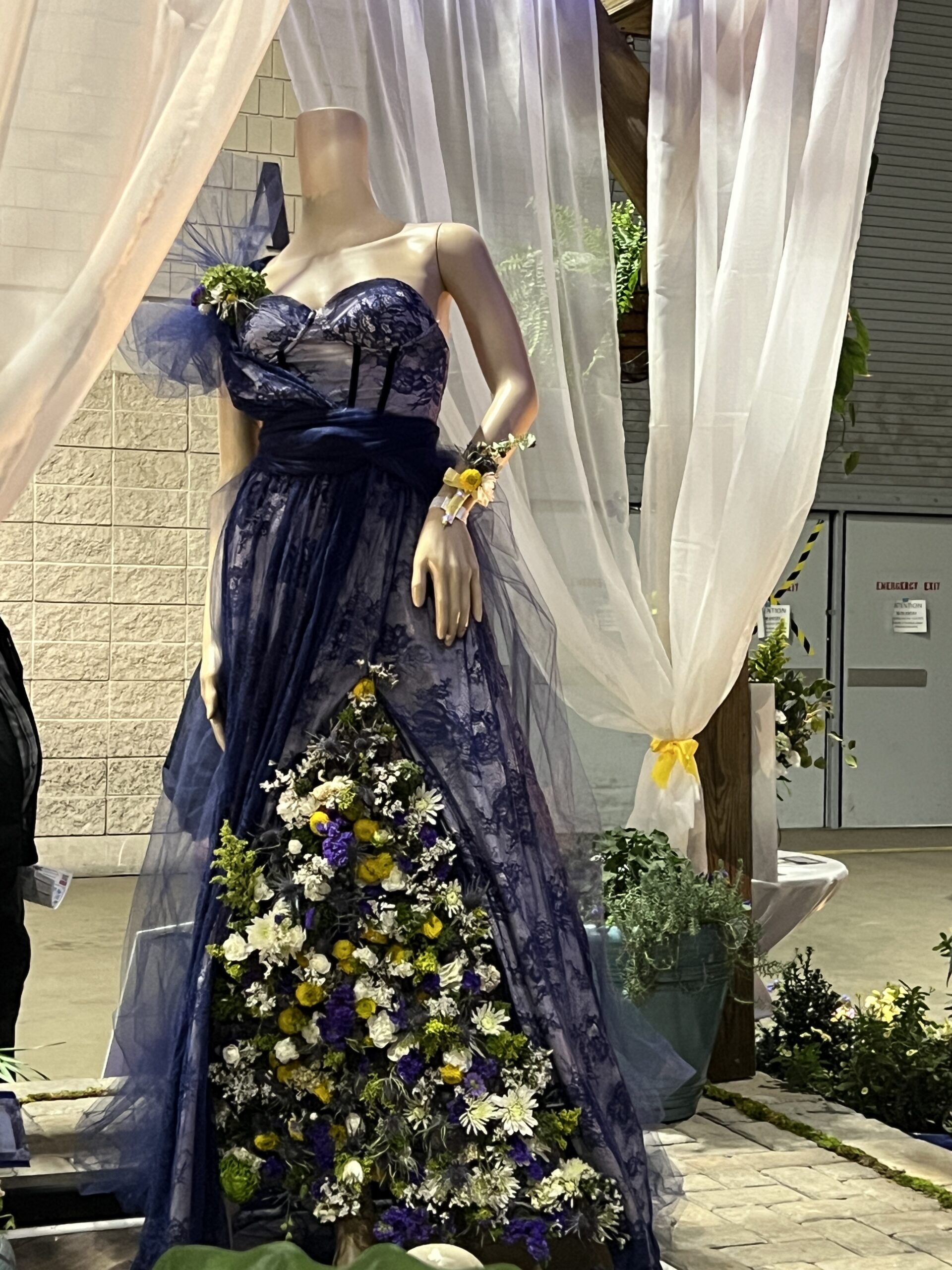 A beautiful purple dress is created from lace, tulle, and flowers at the Philadelphia Flower Show