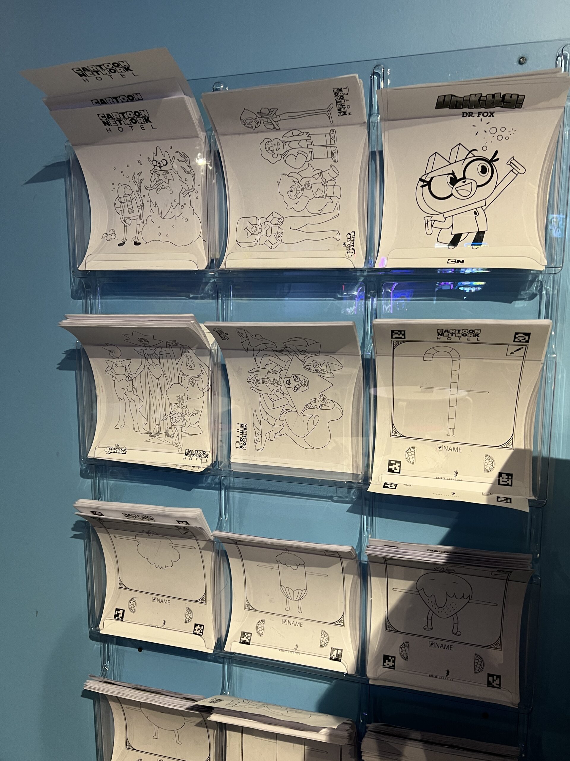 Wall of coloring sheets for kids at Cartoon Network Hotel in Lancaster