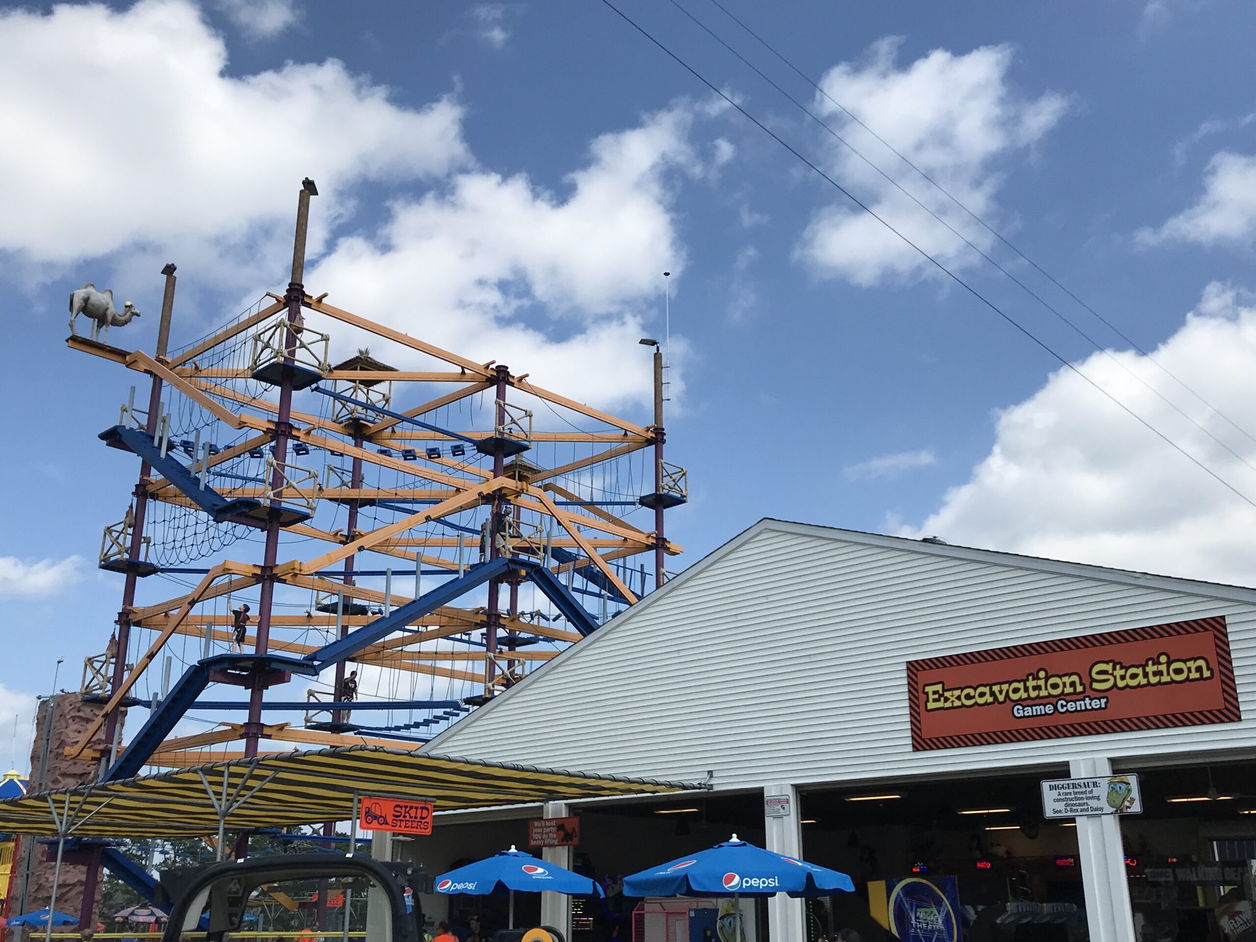 ropes course behind arcade at Diggerland