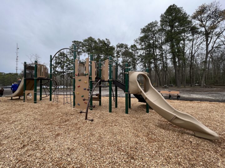Climbing Feature on larger playground twisty slide end Birch Grove Park Playground in Northfield NJ WIDE image