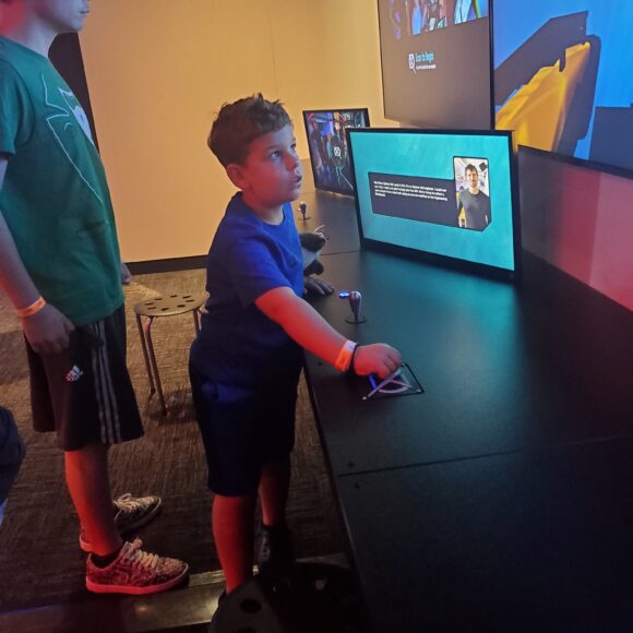 controlling a ship with a joystick at OceanXperience at Liberty Science Center in Jersey City NJ