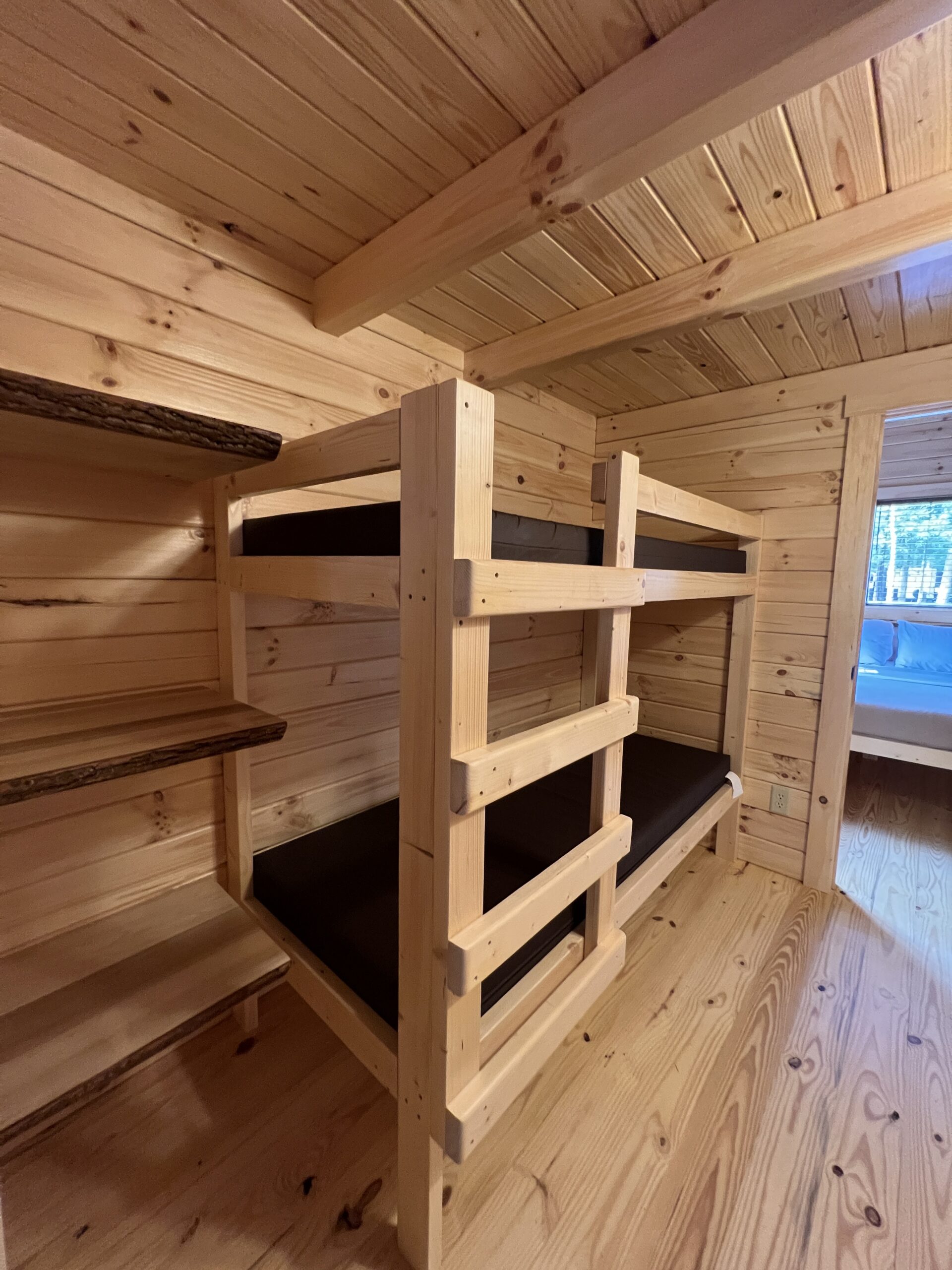 Bunk beds inside Jellystone Campground Deluxe Cabin Portrait image