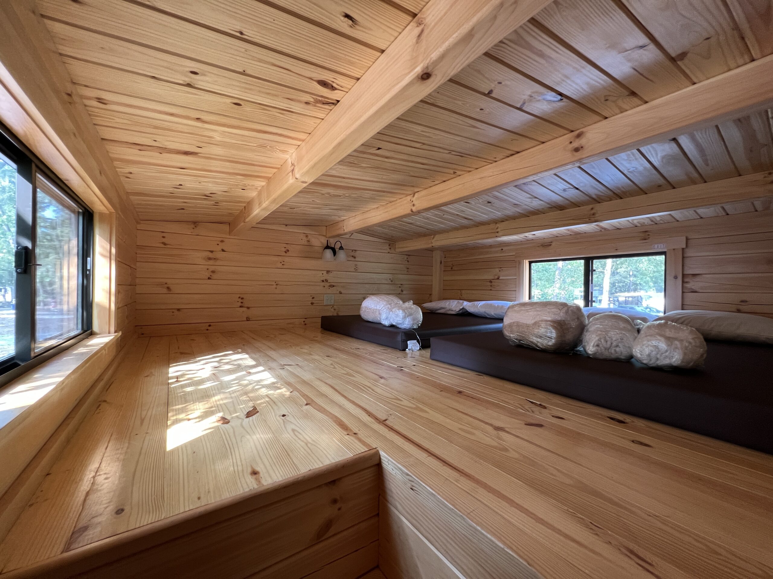 Loft with 2 twin beds inside Jellystone Campground Deluxe Cabin